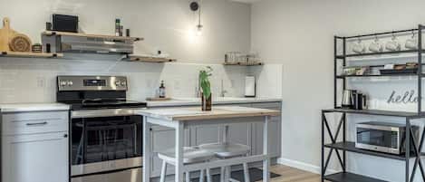 Eat in kitchen area with electric range.