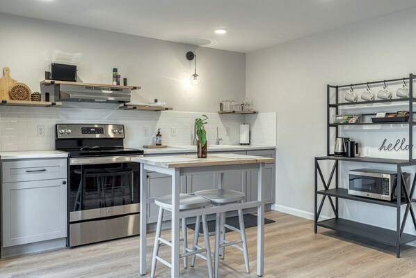 Eat in kitchen area with electric range.