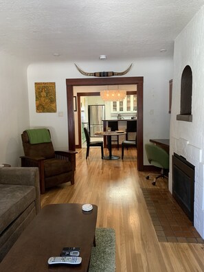 Living room opens up into the dining room and kitchen.