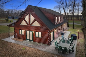 Areal / dusk view of the Thompsonville Lodge back patio furniture