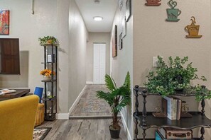 The hallway to the bedrooms is off the living room.
