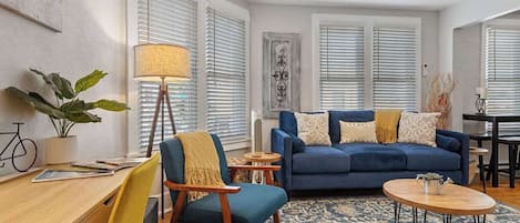 The living room has recently gotten new, comfortable furniture.