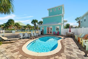 Enjoy the pool courtyard located between the main home and carriage house