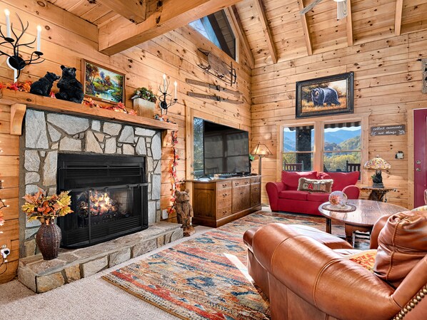 Living room with a walkout deck and views out every window.