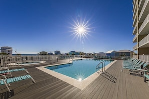 Cool off in the community pool, which includes a kiddie pool and lounge chairs.