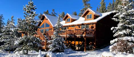 A genuine log cabin with snow summit views.