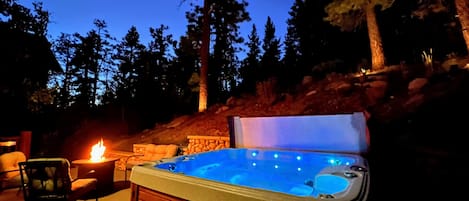 Enjoy the Jacuzzi and fire pit in back yard looking out at the nature preserve.