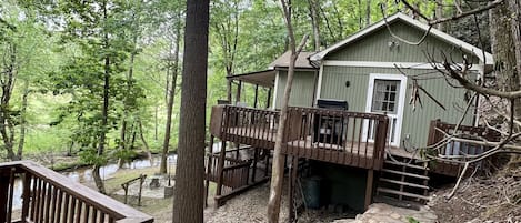 Entrance side of Roho’s Cabin; rock patio and walkway 