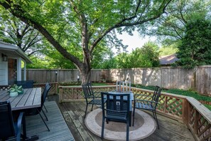 Backyard and Deck with propane FIRE PIT and large dining table. Imagine your family sitting around the fire pit roasting S'mores. 