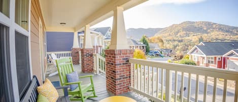 From our large front porch at the top of a charming mountainside neighborhood, enjoy ample seating, incredible mountain views, bird watching, and memory making.