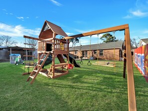 A deluxe playset to swing and slide