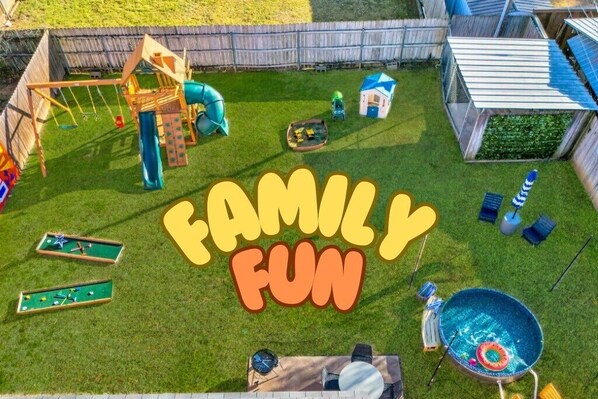 Backyard family fun including a pool, playset, mini golf, and more!