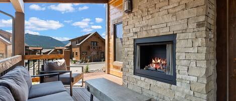 Outdoor patio with fireplace and private jacuzzi