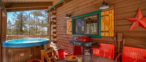 Covered Hot Tub and Outdoor Deck with Seating and Grill