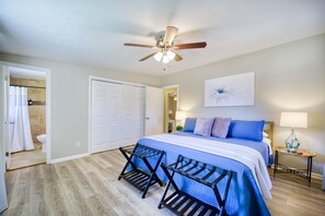 Serene master suite with a king bed, en-suite bathroom, and modern décor for a peaceful stay.