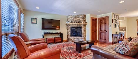 Living room with TV, and gas fireplace