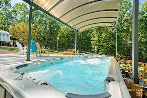 Get your workout in the swim spa, or heat it for a hot tub big enough for all!