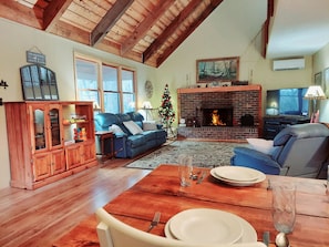 Large, Open Two-Story Living Room overlooking Fireplace from Dining Table
