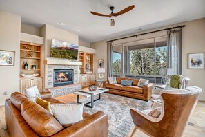 Comfortable Living Room with a Gas Fireplace and Smart TV with Cable