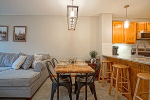 The dining room table seats 4.