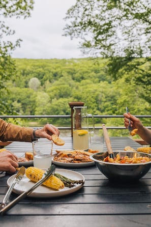 Enjoy meals on the overlook deck with beautiful views all around. Whether it’s breakfast in the fresh morning air or dinner at sunset, this elevated outdoor space is perfect for dining surrounded by nature.