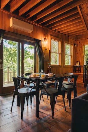 Sit around the dinner table as you look out the glass doors.  There is plenty of seating and plenty of room for all of your fresh food. 