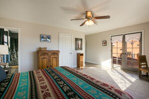 southwestern decor and nature photos in with french doors opening to courtyard