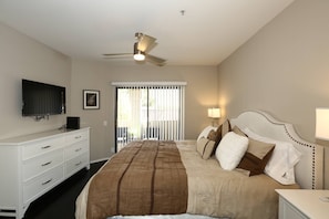 Master bedroom w/ private bathroom & access to balcony