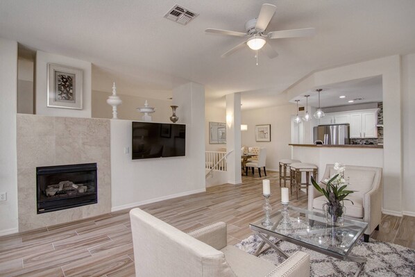 Main gathering room with flat screen tv and gas fireplace
