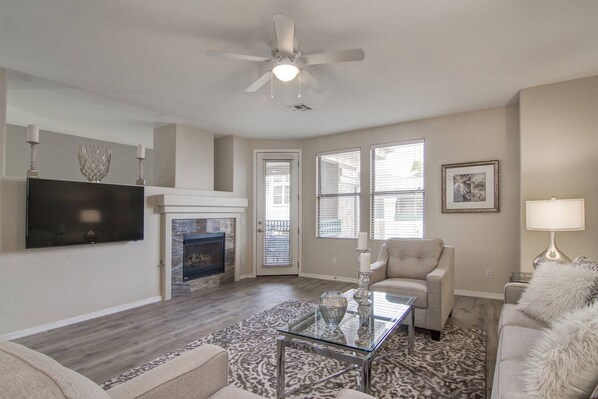 Gas fireplace, 55" Smart TV, Sleeper sofa, 2 chairs and access to balcony