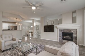 Main gathering room with flat screen tv and gas fireplace