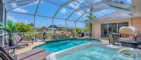 Beautiful South Gulf Cove home with private pool, hot tub, and canal access
