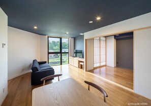 The dining room has a great view, and warm sunlight pours in through the windows.