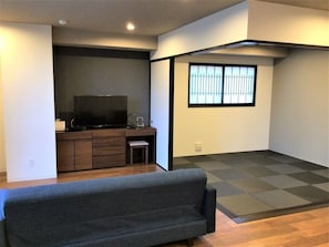 Spacious living room and modern room with Ryukyu tatami mats