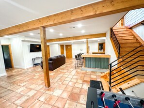 Ground floor / basement. Bunk bed room door is to the left of the tv