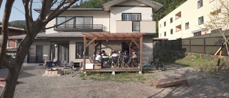 View of the wooden deck from the garden of the house