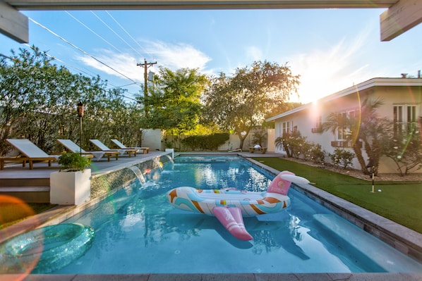 Pool with water feature and Baja shelf.