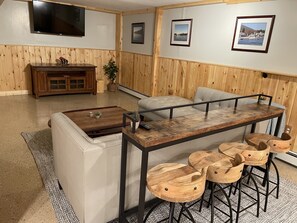 Basement sectional, television and seated console 
