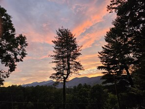 Sunset view from expansive front deck of home.