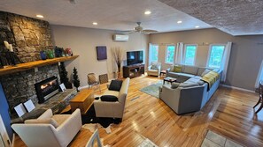 Enjoy the open living area with adjoining kitchen to your right in this picture.