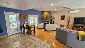View of the breakfast bar,  fireplace, and entertainment center seating.