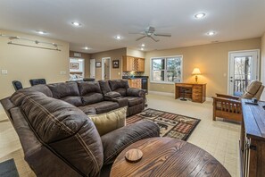 Lower level den with wet bar and walk out porch