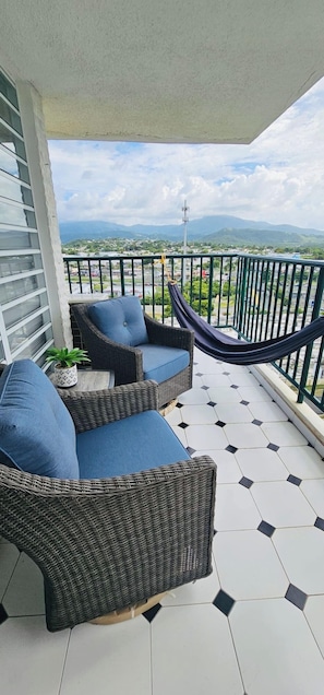 Relax on your private balcony overlooking the beach, El Yunque and grounds.