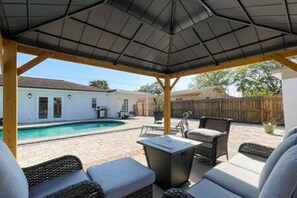 Comfy & Covered Outdoor Seating & Warm Firepit