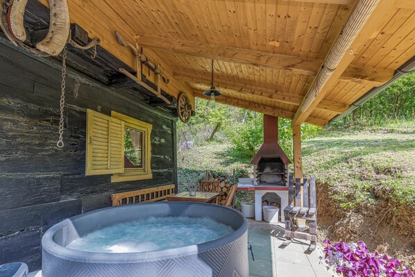 Terrace with hot tub and brick grill