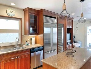 Spacious and modern kitchen perfect for the chef in your group. Prepare culinary delights on the modern stainless steel appliances and gas range available for you to use. Our kitchen is fully stocked and complete with pots and pans as well as various chin