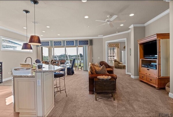 2nd Level sitting area, dining , porch and kitchen