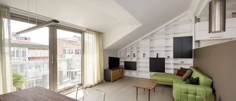 Bright living room with outdoor balcony space! 