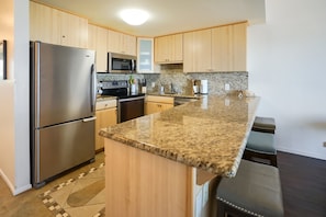 Stainless appliances, granite counters and super-well stocked!