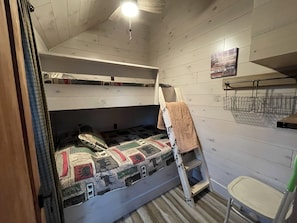 Smaller bedroom with built in bunk bed. Full on bottom and twin on top.